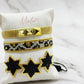 Set of Gold and Black Star Bracelets